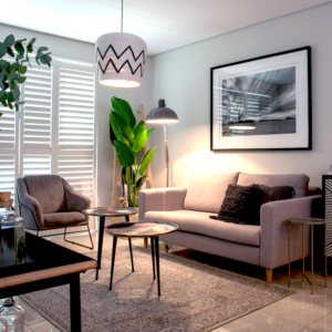 Bespoke residential interior design living room in Johannesburg by edge.ids, featuring designer lighting and custom furniture curation.