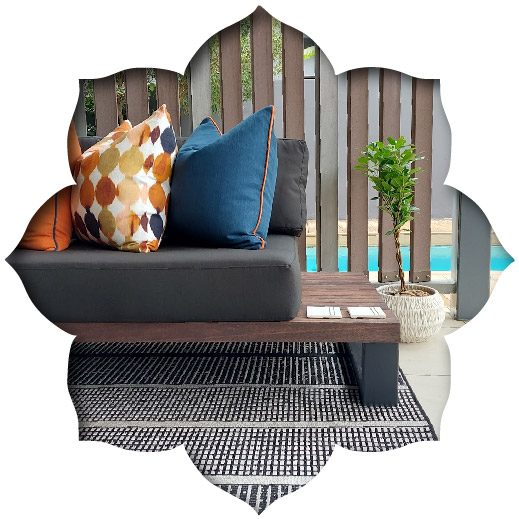 Detailed view of custom steel and wood patio furniture with bespoke patterned scatter cushions by Edge.IDS.
