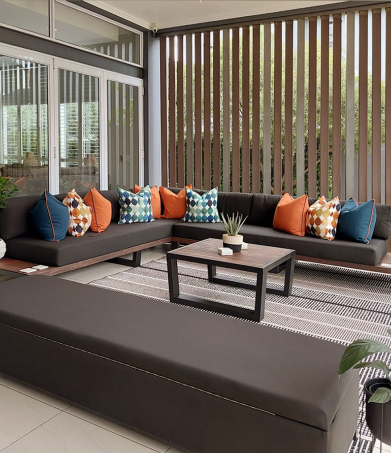 Custom steel and wood patio furniture set with bespoke scatter cushions by Edge.IDS at Waterfall Country Estate.